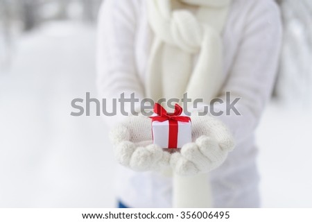 Closeup woman holding a gift