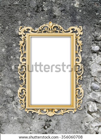 Close-up of one golden baroque picture frame on weathered wall background