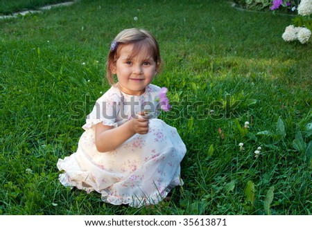 Happy little girl with flower