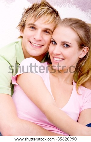 young couple hugging in their new home