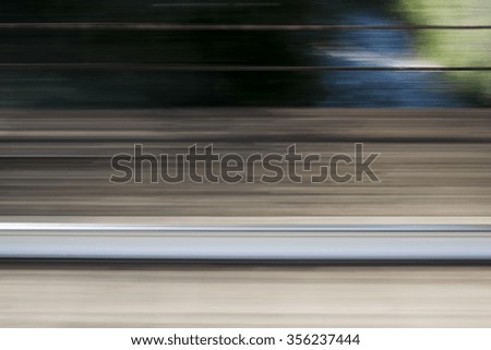 blurred landscape from train window