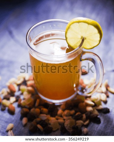 photo of green tea with lemon and nuts