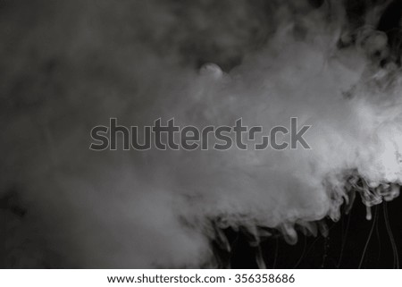 Smoke cloud over black background