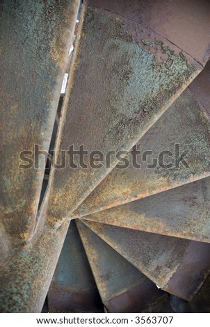 Old rusty spiral fire escape stairs