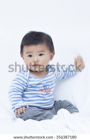 Cute Chinese baby boy in sailor suit, shot in Beijing, China