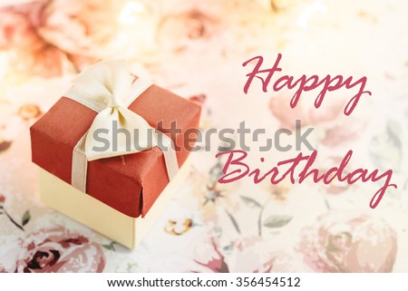 simple surprise box with happy birthday text  on stylish flower paper, greeting card concept