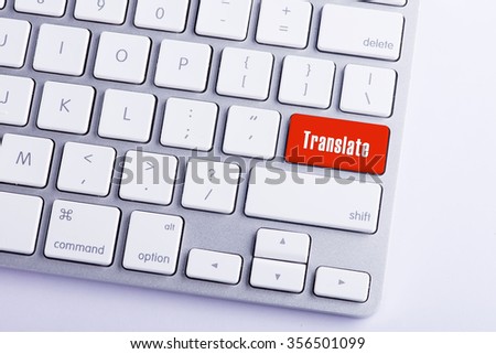 Close up of keyboard and translate word key in red color