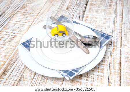 white plate with car  on wood vintage background