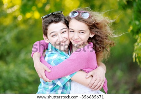 Portrait of a boy and girl  in summer