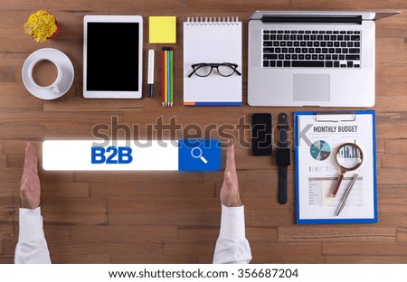 Businessman working on desk - B2B concept
