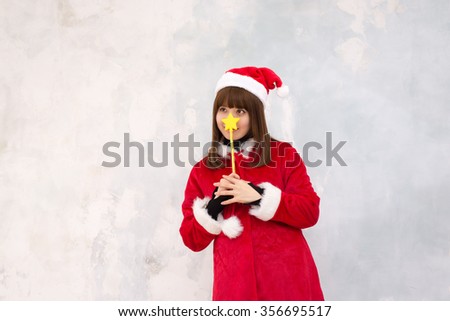 A portrait of Japanese girl dressed as a santa claus