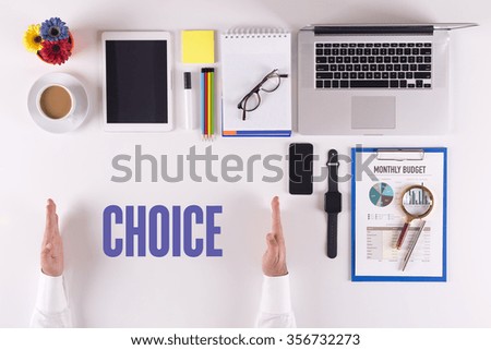 Businessman working on desk - hands showing CHOICE concept
