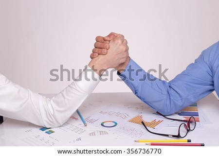 Two Businessman Competing In Arm Wrestling