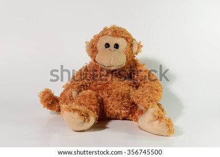 Cute monkey doll on white background