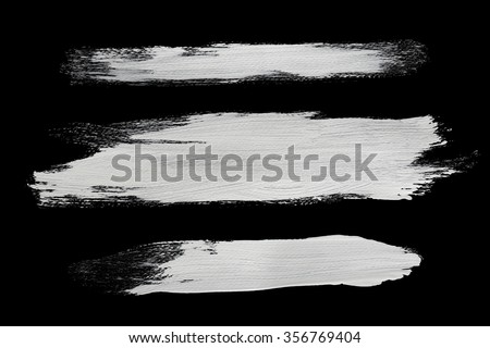 real white brush strokes with detailed texture on black Royalty-Free Stock Photo #356769404