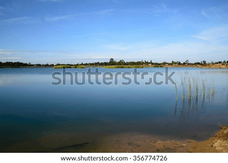 landscape with blue sky at the calm lake