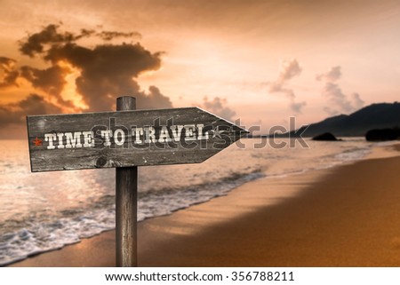 Time to Travel wooden sign with holiday background