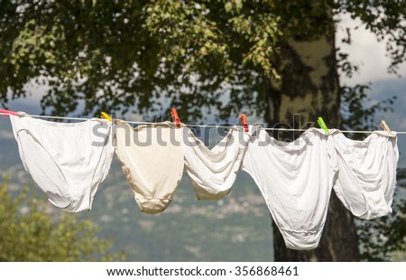Under wear hanging on a clothes line Royalty-Free Stock Photo #356868461