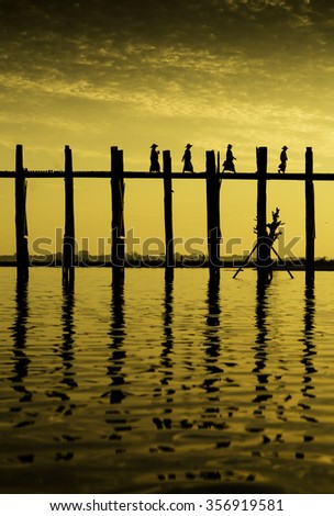 UBein teak wood bridge and people against sunlight in sunset time,Mandalay:Myanmar