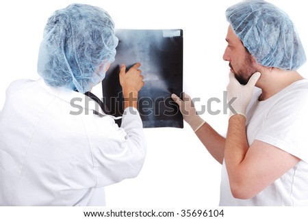 Two male doctors looking at scan image