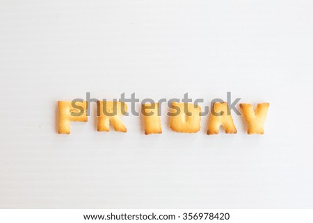 word friday made of biscuits on white background