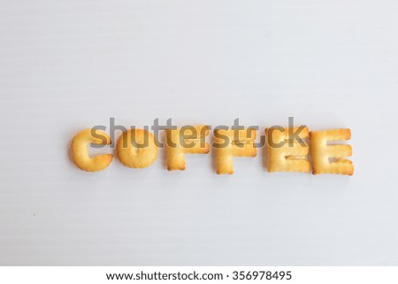 word coffee made of biscuits on white background