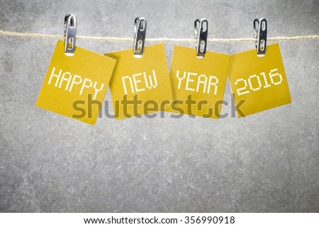 happy new year 2016 word hanging on the Notes paper cards in clothes pegs on rope
