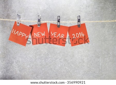 happy new year 2016 word hanging on the Notes paper cards in clothes pegs on rope