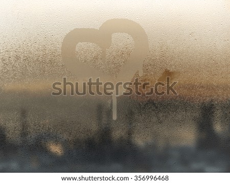 Heart painted on misted glass
