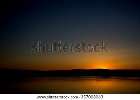 River sunset Royalty-Free Stock Photo #357008063