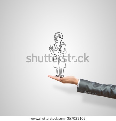 Drawn woman doctor in female palm on gray background