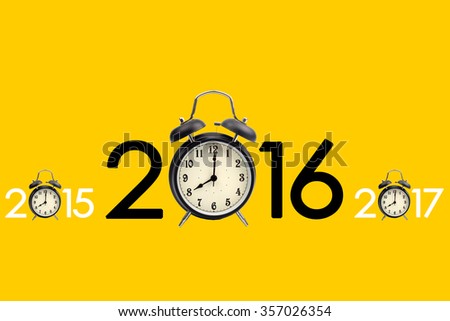 Eight o'clock on a round alarm clock and show three year on yellow background