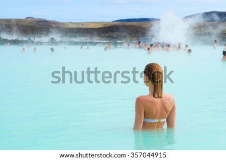 Woman enjoy of spa in hot spring Blue Lagoon in Iceland Royalty-Free Stock Photo #357044915