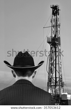 Texas oilman looking at his land prize with room for your type.