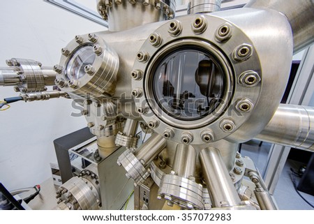 Detail of stainless steel machinery in physics laboratory Royalty-Free Stock Photo #357072983