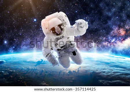 Astronaut Over Earth - Elements of this Image Furnished by NASA