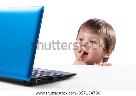 child looking at computer on a white background