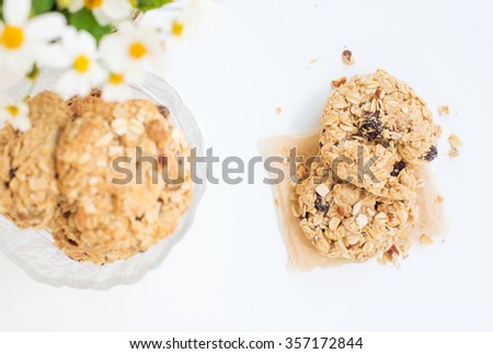home made oatmeal cookies on white wooden table.
