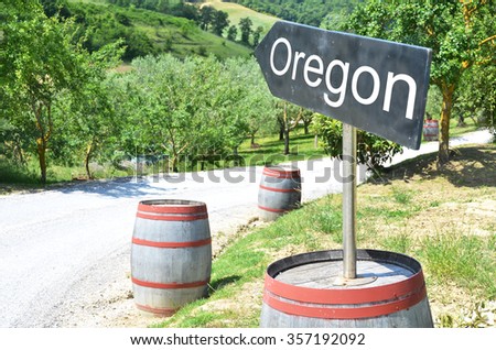  arrow and wine barrels along rural road
