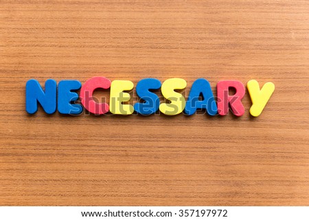 necessary colorful word on the wooden background