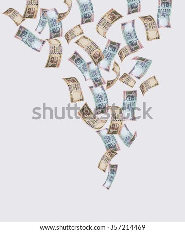 Indian currency notes falling from sky, over white background