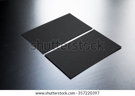 Blank business cards on a wooden background. Photo mock-up. 