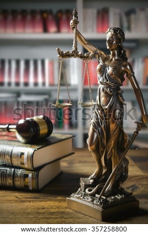 Themis and gavel in court library. Law conception