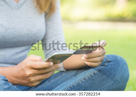 women holding phone and credit card purchase shopping online