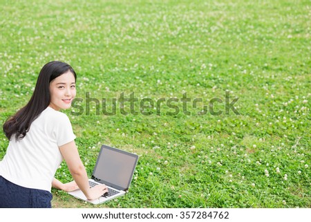 Beautiful young asian woman using laptop computer