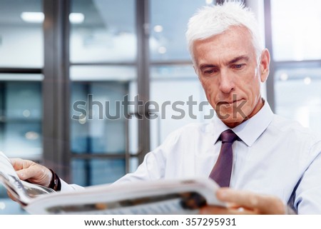 Businessman in office playing chess