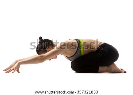 Sporty fit beautiful young brunette woman in sportswear bra and black pants working out, doing Child pose, Balasana, studio full length, isolated, white background