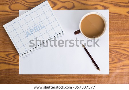 monthly planning schedule on wooden table