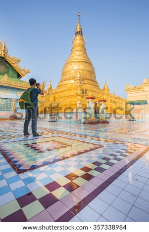 Traveler take a picture Stupa of sky palace in Mandalay Myanmar