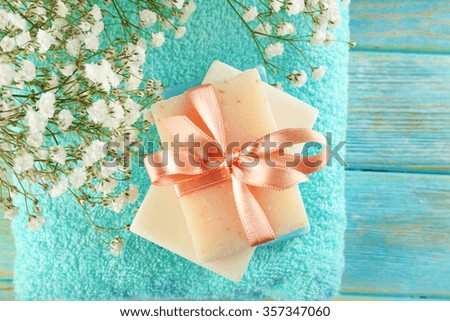 Soap set over towel background